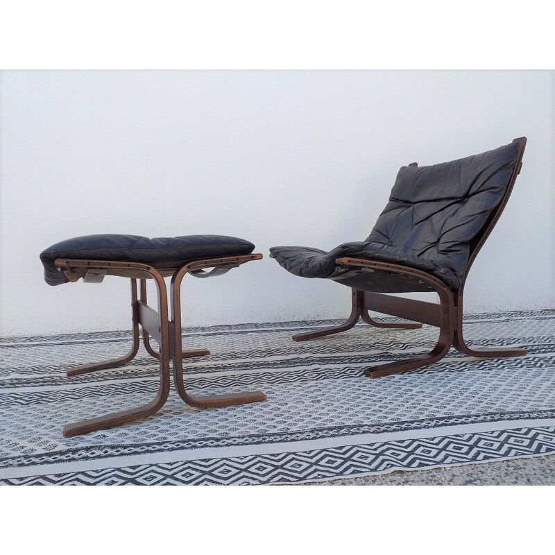 Siesta chair and ottoman in black leather by Ingmar Relling