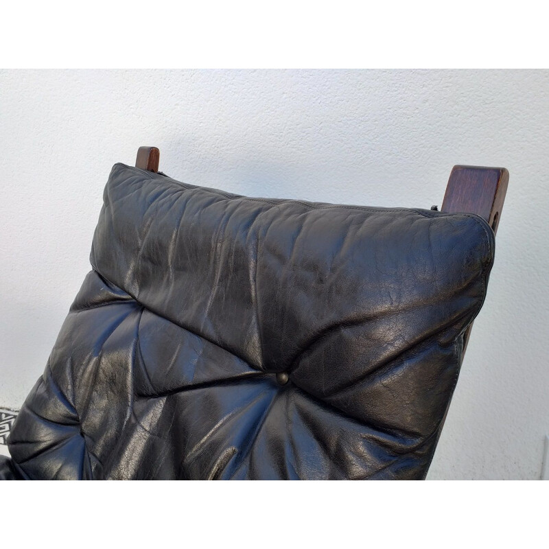 Siesta chair and ottoman in black leather by Ingmar Relling