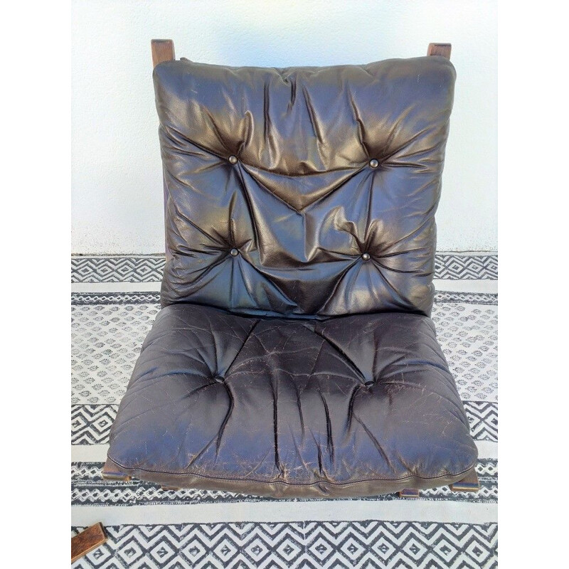 Siesta chair and ottoman in black leather by Ingmar Relling