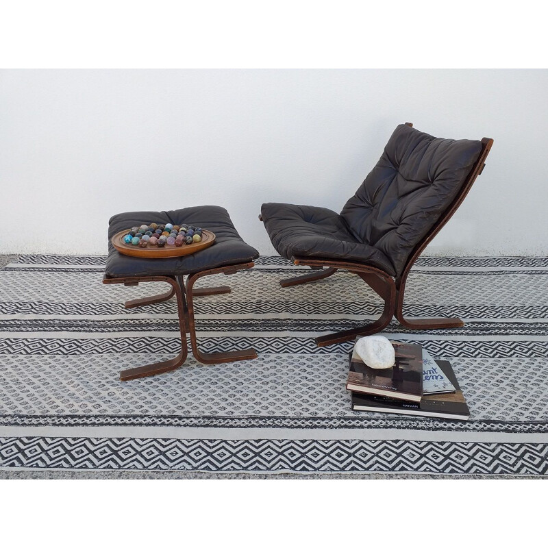 Siesta chair and ottoman in black leather by Ingmar Relling