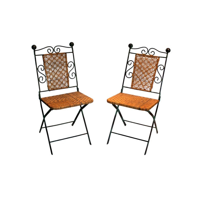 Pair of vintage wrought iron and rattan folding chairs