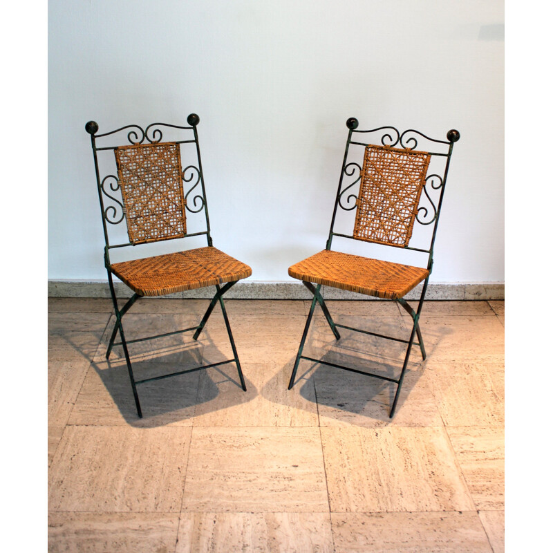 Pair of vintage wrought iron and rattan folding chairs