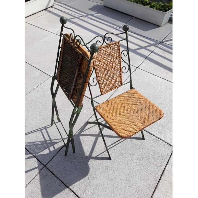 Pair of vintage wrought iron and rattan folding chairs