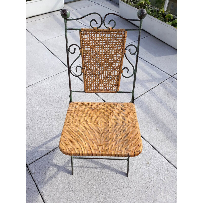 Pair of vintage wrought iron and rattan folding chairs