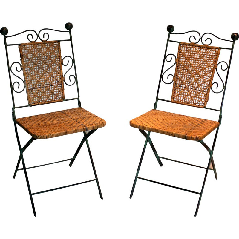 Pair of vintage wrought iron and rattan folding chairs