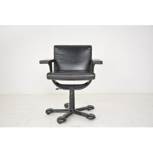 Vintage deskchair swivelling on wheels, in black leather