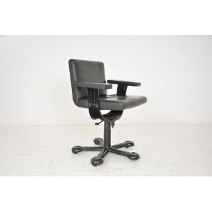 Vintage deskchair swivelling on wheels, in black leather