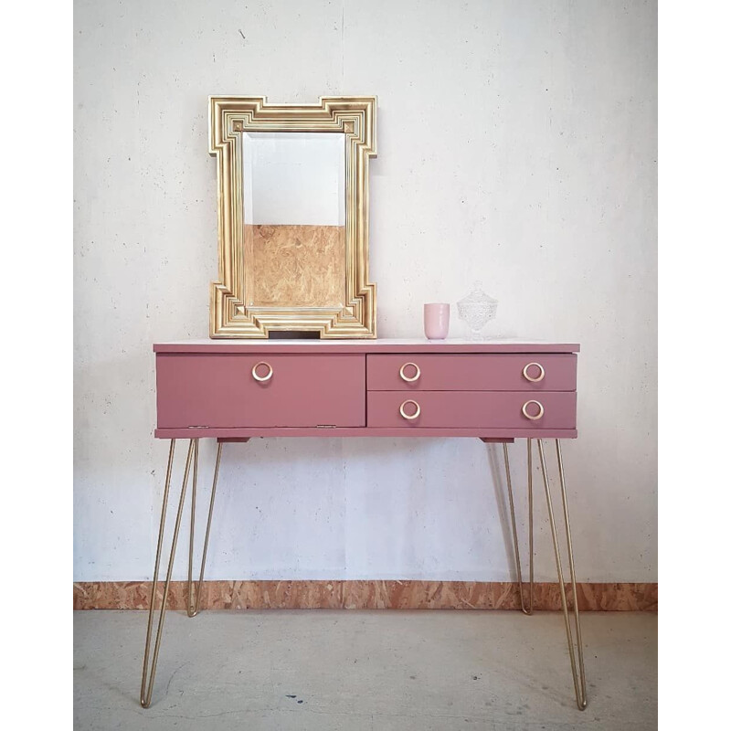 Pink vintage console with compass feet