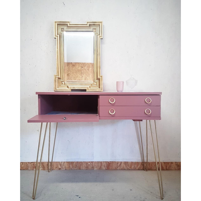 Pink vintage console with compass feet