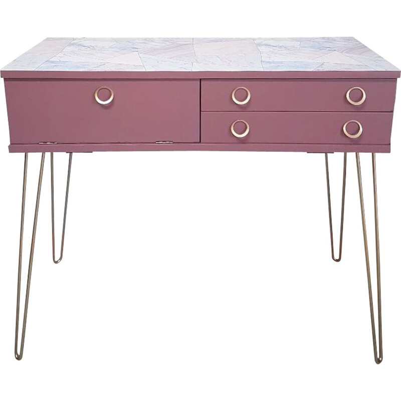 Pink vintage console with compass feet