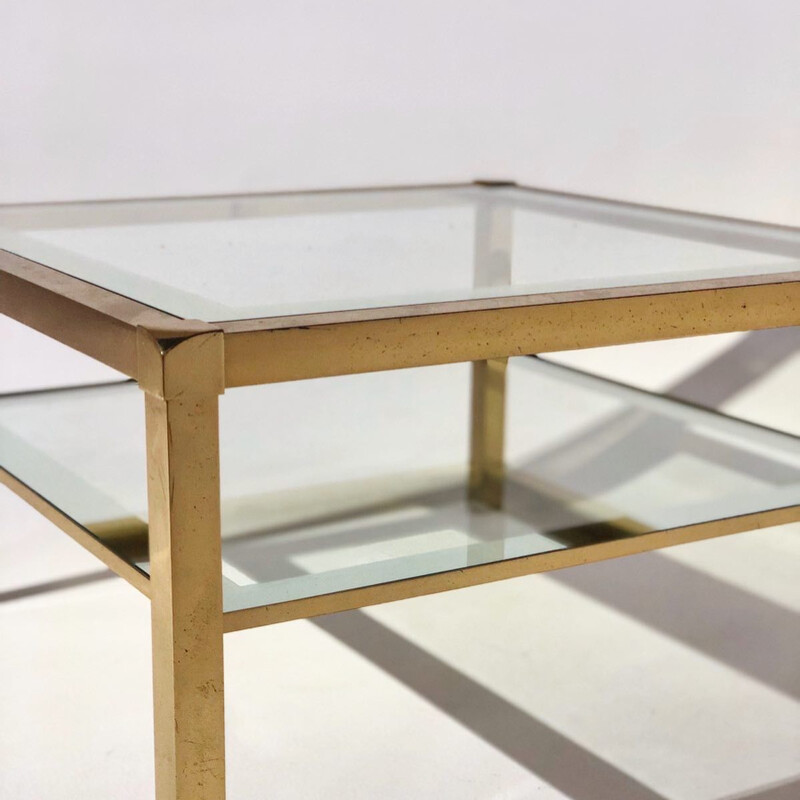 Vintage coffee table with gilded base and glass top