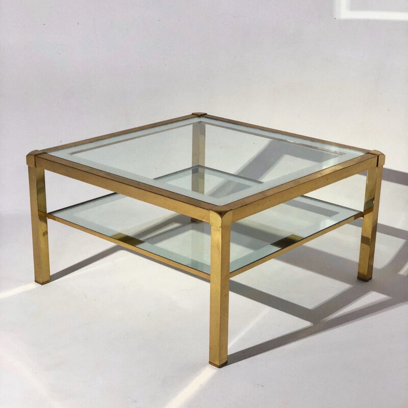 Vintage coffee table with gilded base and glass top