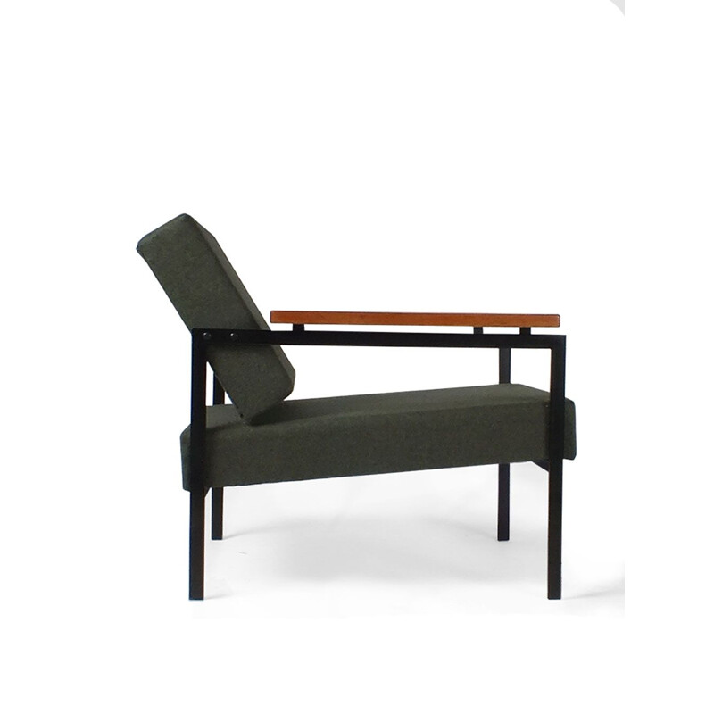 Vintage armchair  with black metal legs and floating wooden armrests for Pastoe