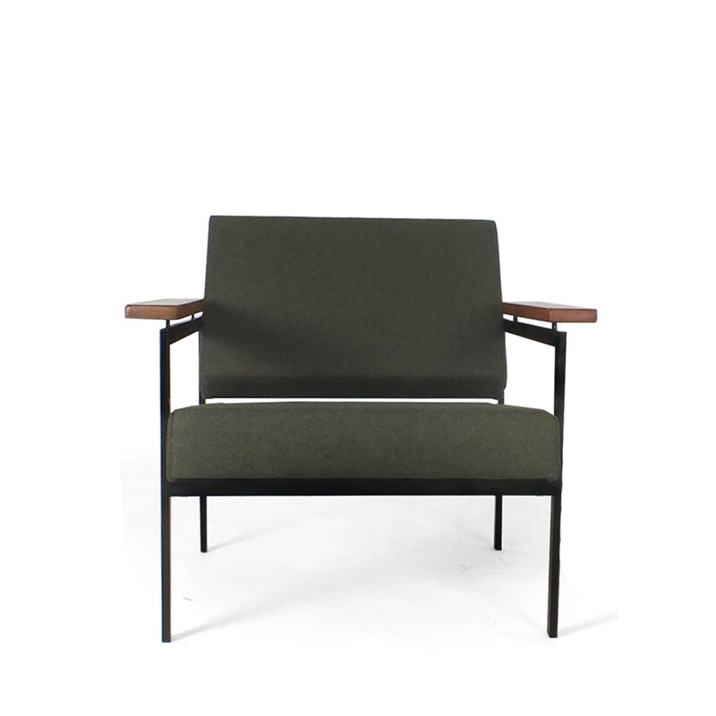 Vintage armchair  with black metal legs and floating wooden armrests for Pastoe