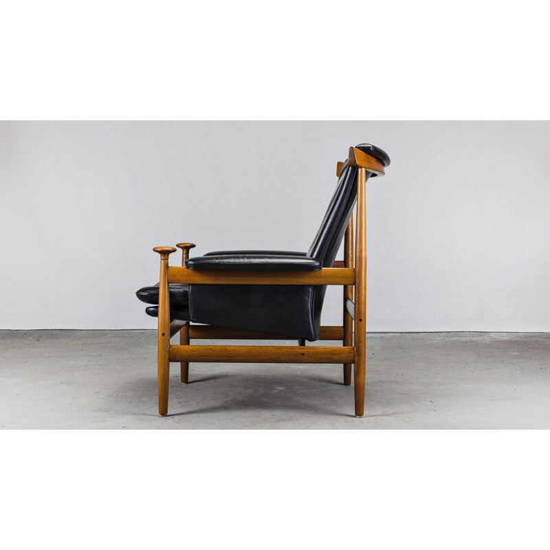 Fauteuil vintage en cuir et teck avec ottoman de Finn Juhl pour France & Son, 1950