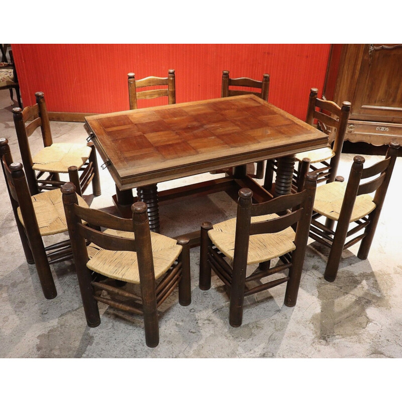 Ensemble à repas vintage avec 1 table et 8 chaises par Charles Dudouyt en chêne massif 1940