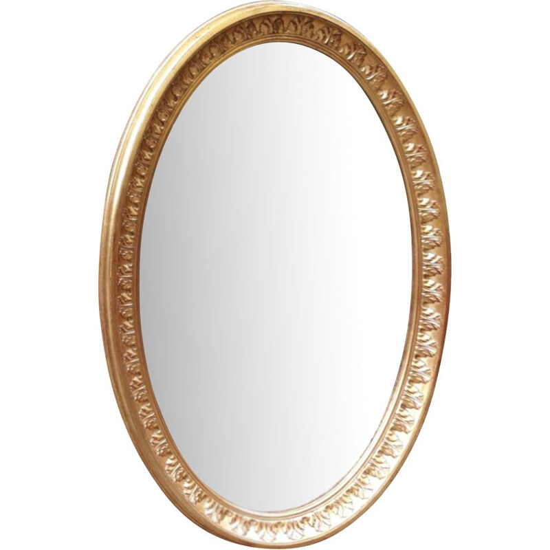 Vintage oval mirror in gilded wood