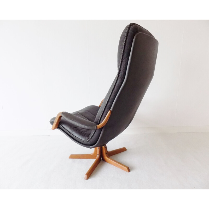 Leather vintage armchair with ottoman by Berg, 1970s