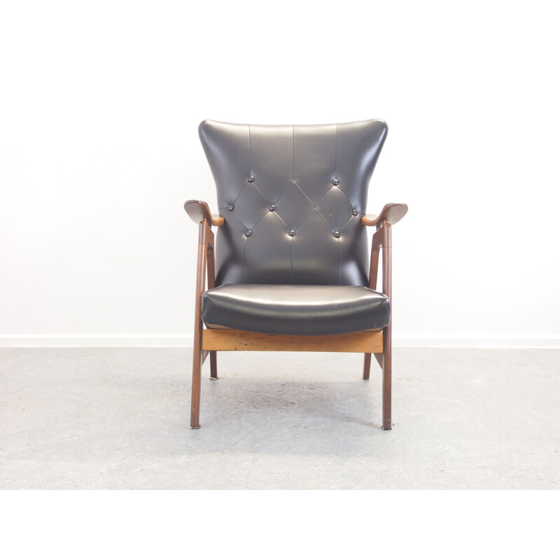 Vintage teak and black padded lounge chair 1950