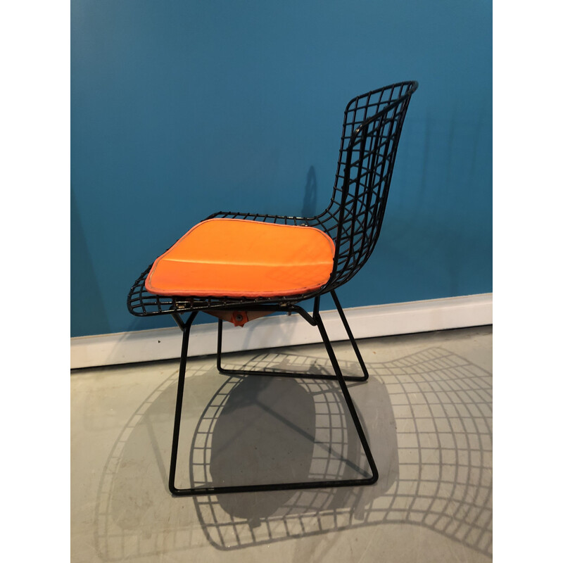 Vintage orange and black chair by Harry Bertoia 