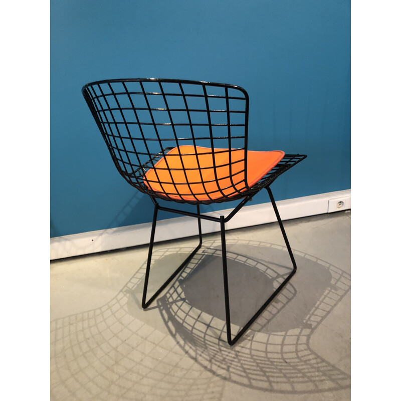 Vintage orange and black chair by Harry Bertoia 