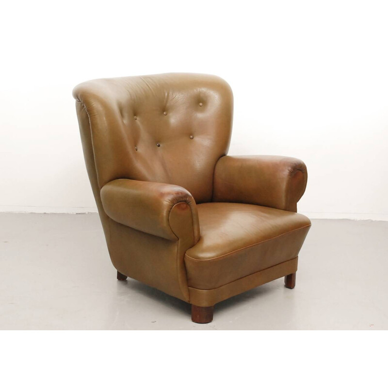 Sillón escandinavo de cuero y madera - 1950