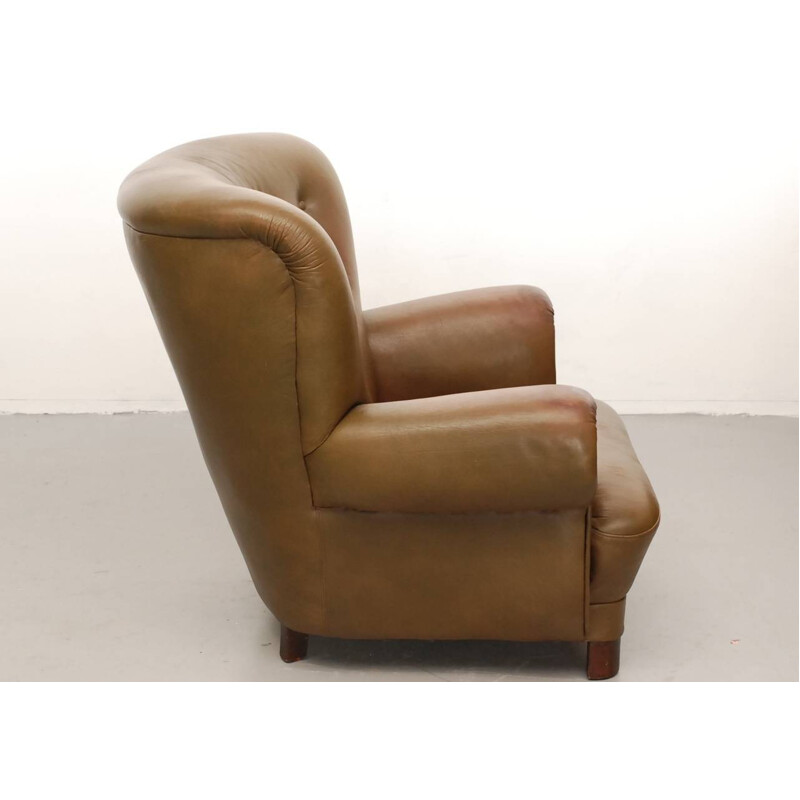 Sillón escandinavo de cuero y madera - 1950