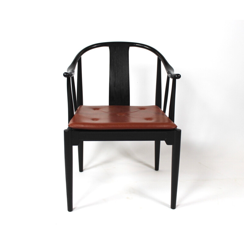 A pair of China chairs of black colored ash by Hans J. Wegner and Fritz Hansen in 2013.