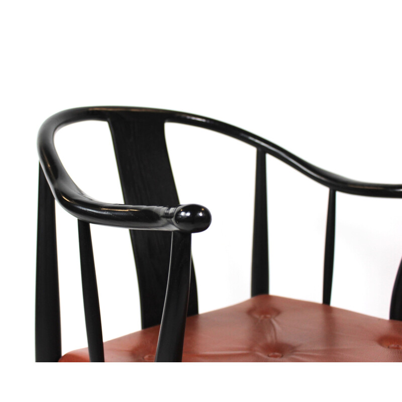 A pair of China chairs of black colored ash by Hans J. Wegner and Fritz Hansen in 2013.