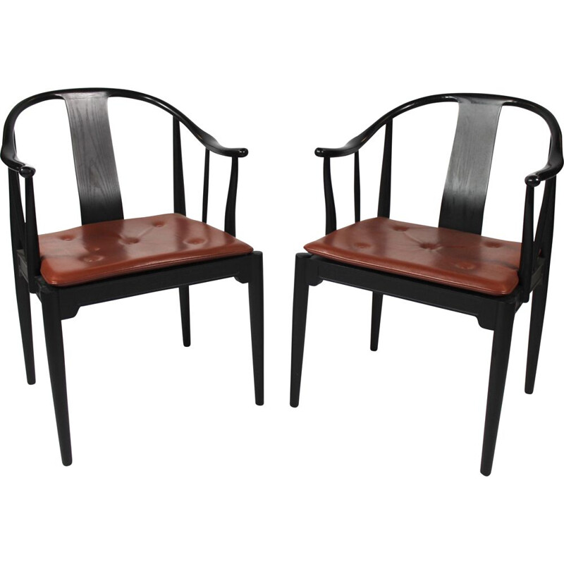 A pair of China chairs of black colored ash by Hans J. Wegner and Fritz Hansen in 2013.