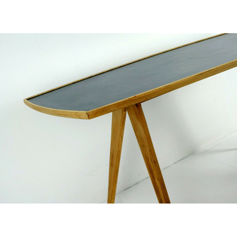 Vintage coffee table in cherry wood and black formica top and slanted legs 