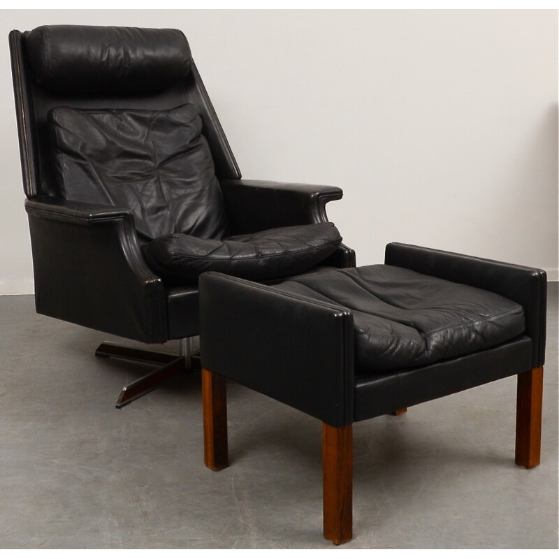 Black swivel armchair with ottoman in leather and steel - 1960s