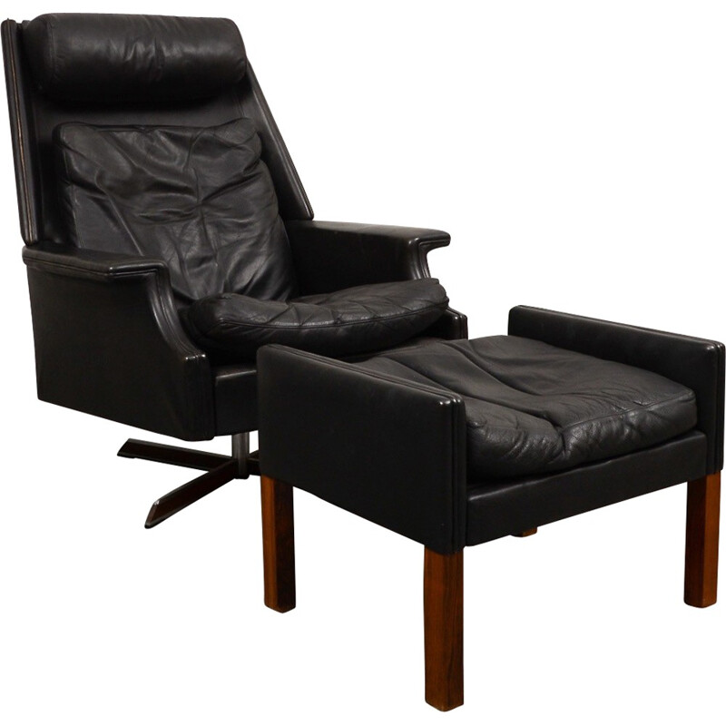 Black swivel armchair with ottoman in leather and steel - 1960s