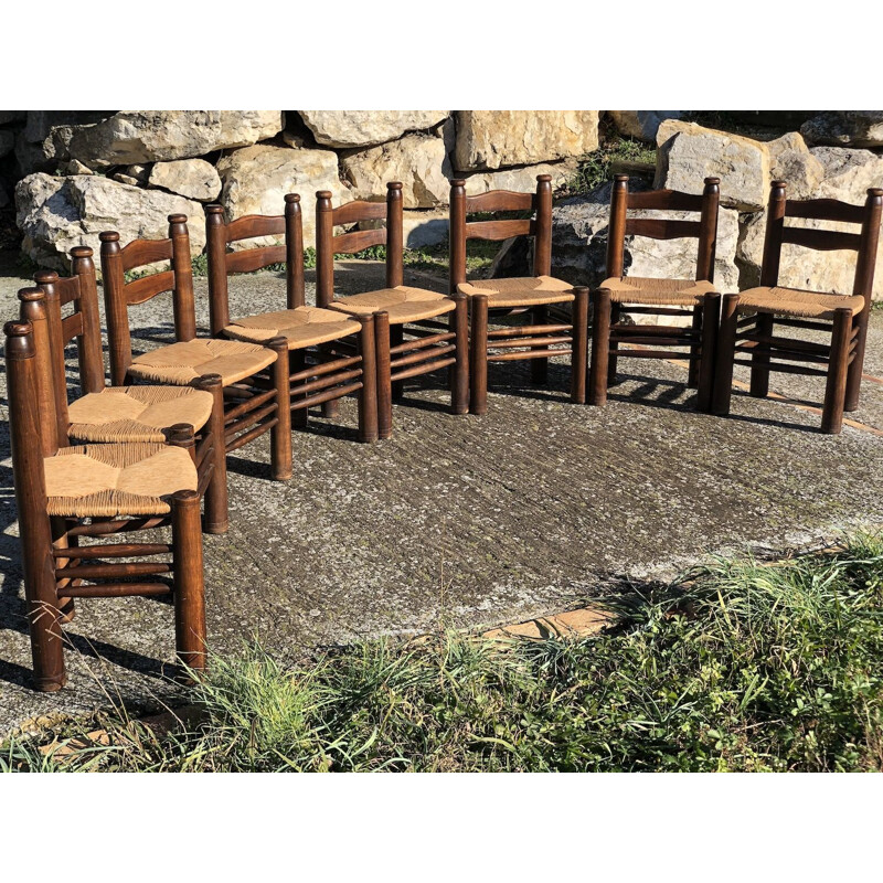 Suite of 8 vintage solid oak chairs by Charles Dudouyt, 1940s