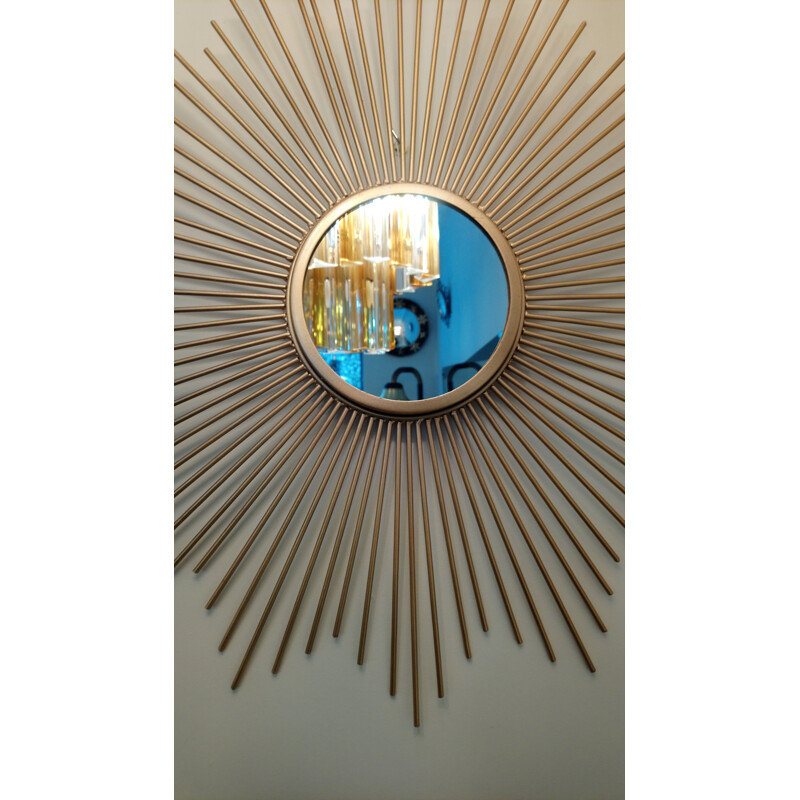 Vintage golden metal sun mirror