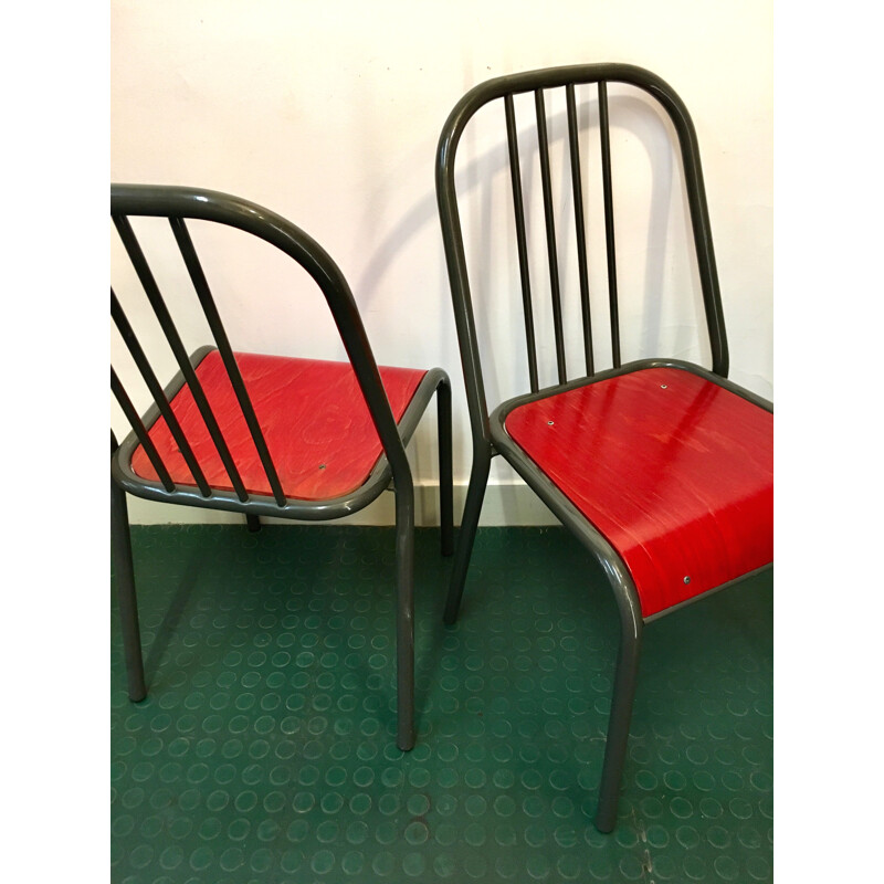 Pair of vintage chairs with red seats