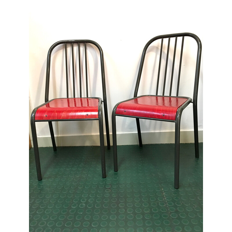 Pair of vintage chairs with red seats