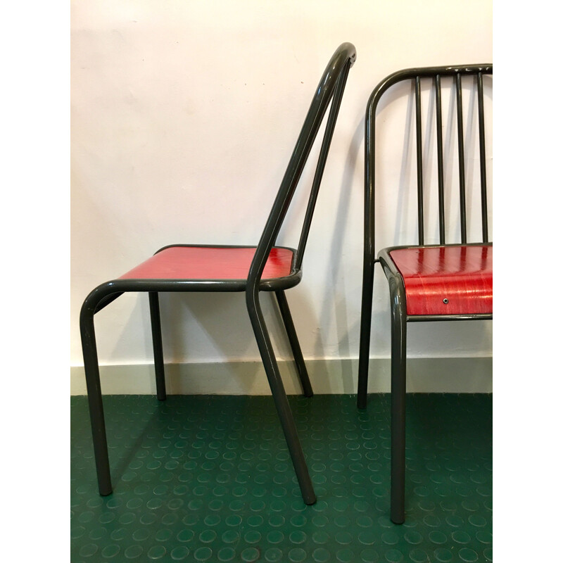 Pair of vintage chairs with red seats