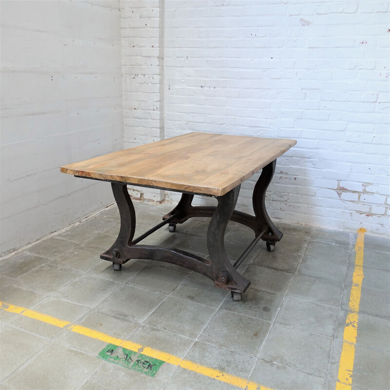 Vintage Industrial cast iron table on wheels