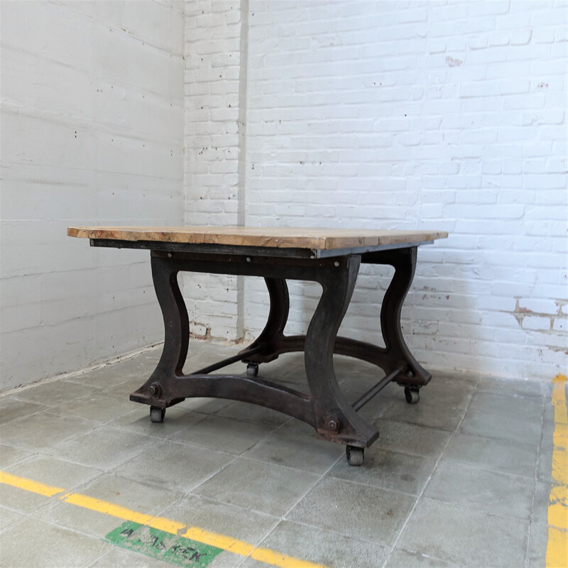 Vintage Industrial cast iron table on wheels