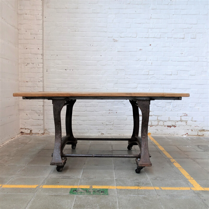 Vintage Industrial cast iron table on wheels