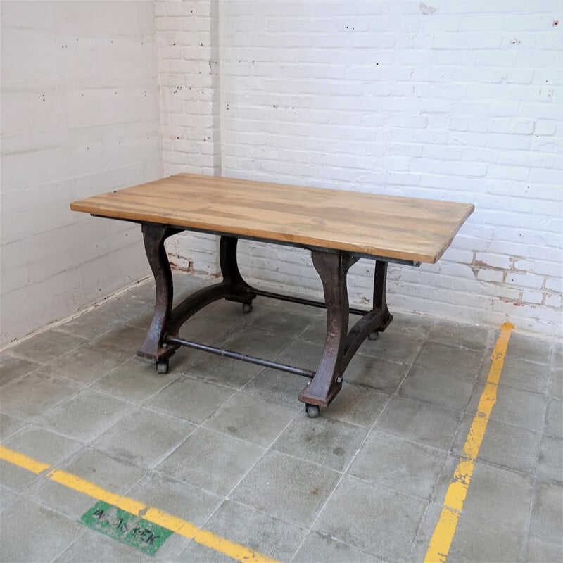 Vintage Industrial cast iron table on wheels