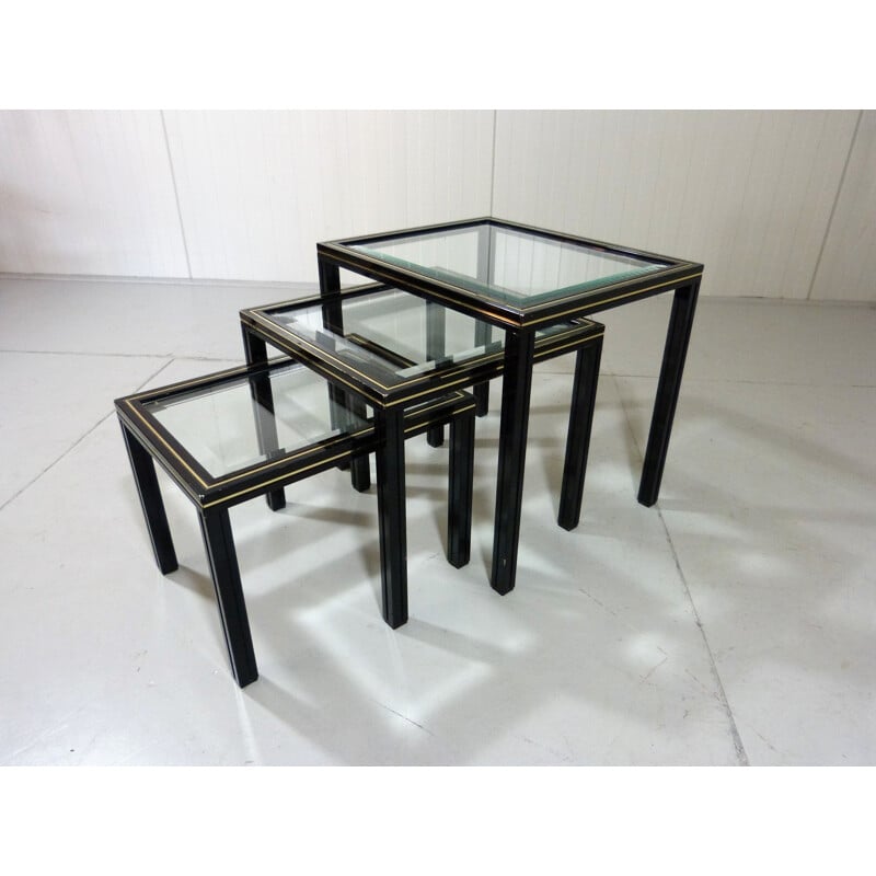 Vintage nesting tables in glass and black and brass fame by Pierre Vandel, France