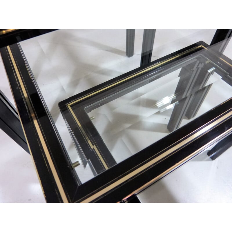 Vintage nesting tables in glass and black and brass fame by Pierre Vandel, France