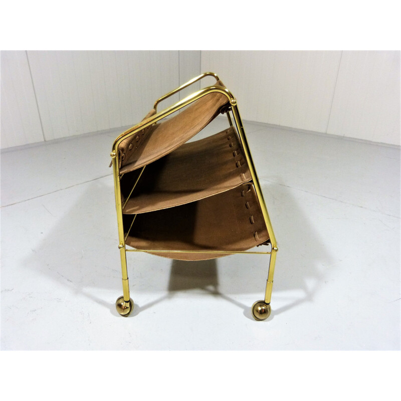 Vintage suede & brass magazine holder on wheels