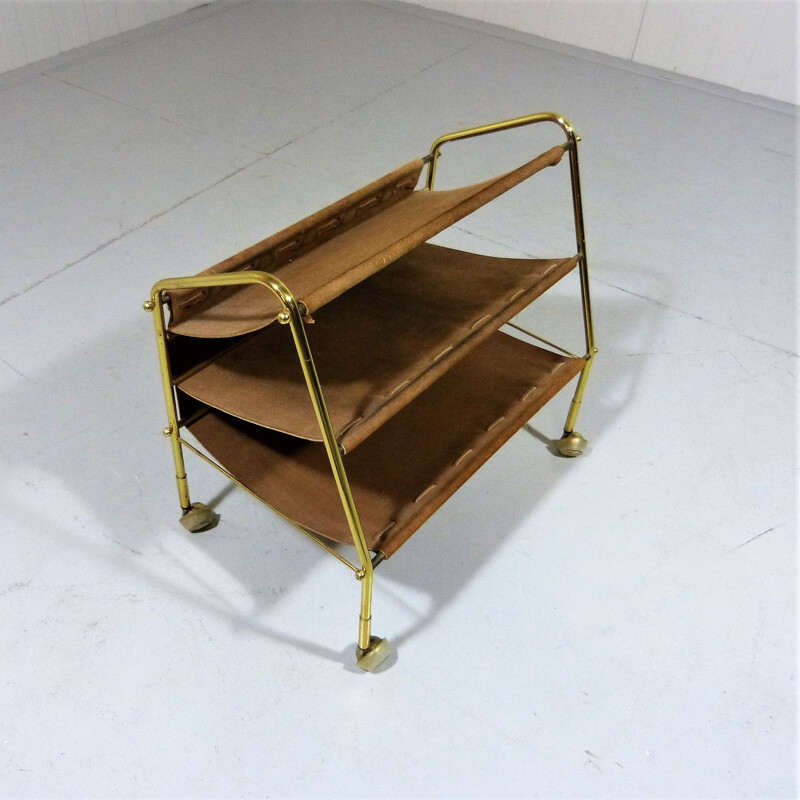 Vintage suede & brass magazine holder on wheels