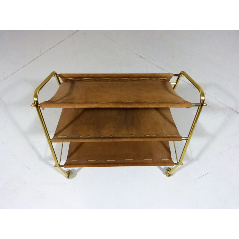 Vintage suede & brass magazine holder on wheels