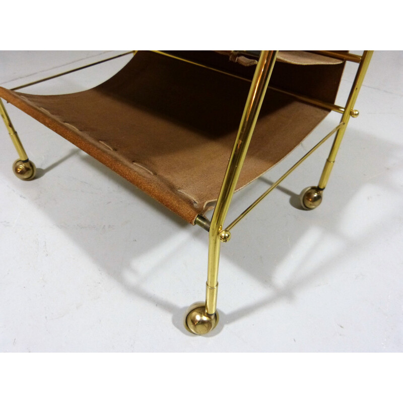 Vintage suede & brass magazine holder on wheels